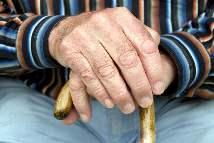 Aged man sitting