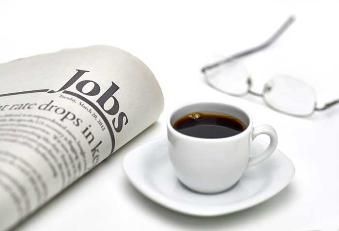 Cup of Tea kept near newspaper