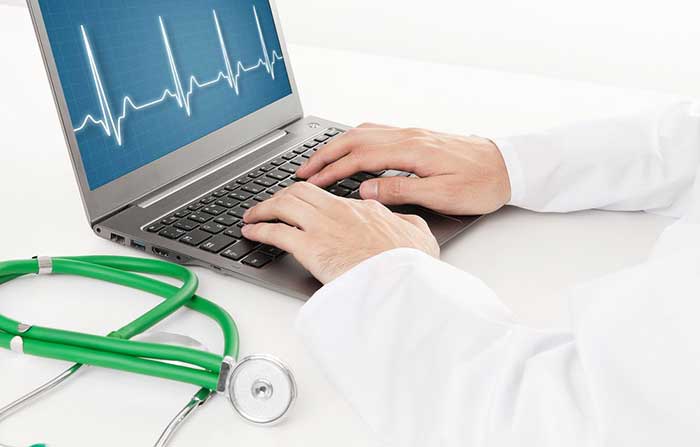 Doctor working on laptop