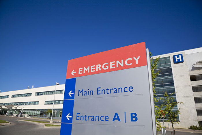 Modern hospital and sign with clear blue sky taken in Brampton Ontario Canada